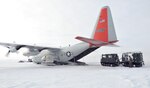 A loadmaster with the New York Air National Guard's 109th Airlift Wing loads a Canadian transport vehicle onto an LC-130 "Skibird" at Little Cornwallis Island, Nunavut, Canada, on April 13, 2016, in support of Canada's annual Operation Nunalivut. A group of eight Airmen from the 109th AW prepared the ski-way for LC-130 operations and also trained four Canadian engineers on how to build the ski-way. 