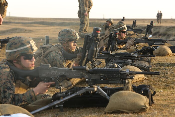 U.S. Marines with Black Sea Rotational Force fire M240B light machine guns during a live-fire exercise to confirm their zero aboard Mihail Kognalniceanu Air Base, Romania, Feb. 2, 2016. Marines from 1st Battalion, 8th Marine Regiment, conducted battle sight zeroes on various individual weapons systems, to prepare for future BSRF exercises and contingencies. (U.S. Marine Corps photo by Cpl. Kelly L. Street, 2D MARDIV COMCAM/Released)