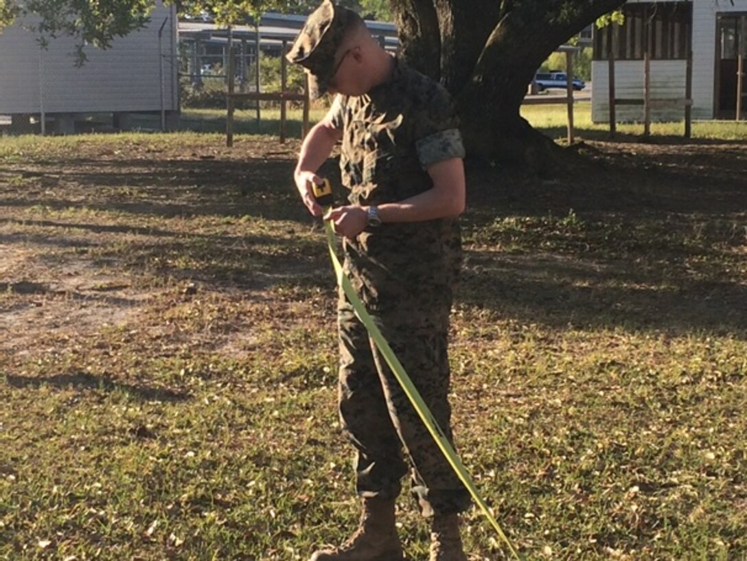 On April 18, 2016, First Lieutenant Jonathan Lanning Keller, a Marine attached to Combat Engineer Officer course 5-16 (CEO 5-16); measures building dimensions during a vertical construction practical application.  These measurements help to ensure that buildings are built on an even surface.
