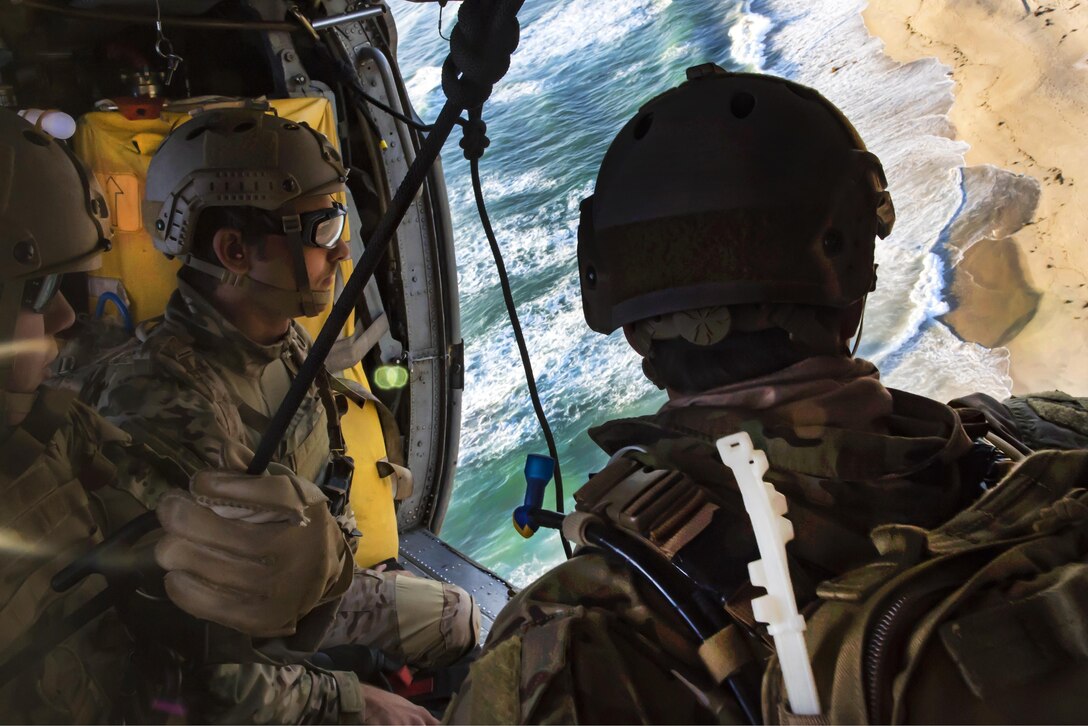 Sailors prepare to rappel from an MH-60S Seahawk helicopter during a helicopter rope suspension training event in Imperial Beach, Calif., April 21, 2016. Navy photo by Seaman Kelsey L. Adams