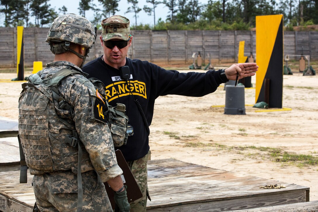 Army 1st Lt. Kevin Comiskey, left, receives guidance from an Army Ranger instructor during Best Ranger Competition 2016 at Fort Benning, Ga., April 15, 2016. Comiskey is assigned to the 10th Mountain Division.  Army photo by Spc. Steven Hitchcock