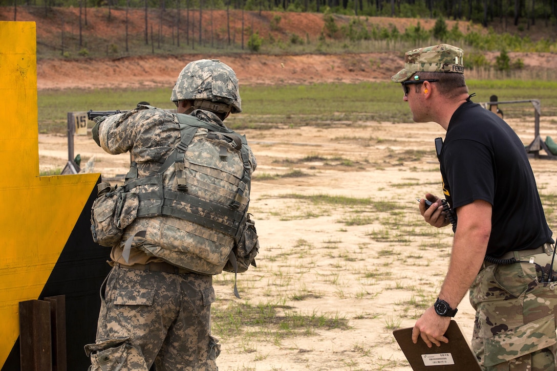 An Army Ranger fires his pistol on the stress shoot range during Best Ranger Competition 2016 at Fort Benning, Ga., April 15, 2016. Army photo by Spc. Steven Hitchcock