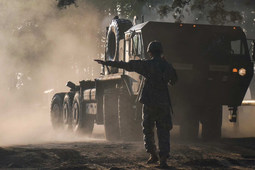 Army Spec. Juan Hernandez directs a loading vehicle during Beyond the Horizon 2016, a joint military humanitarian civic assistance exercise, in San Marcos, Guatemala, April 25, 2016. 