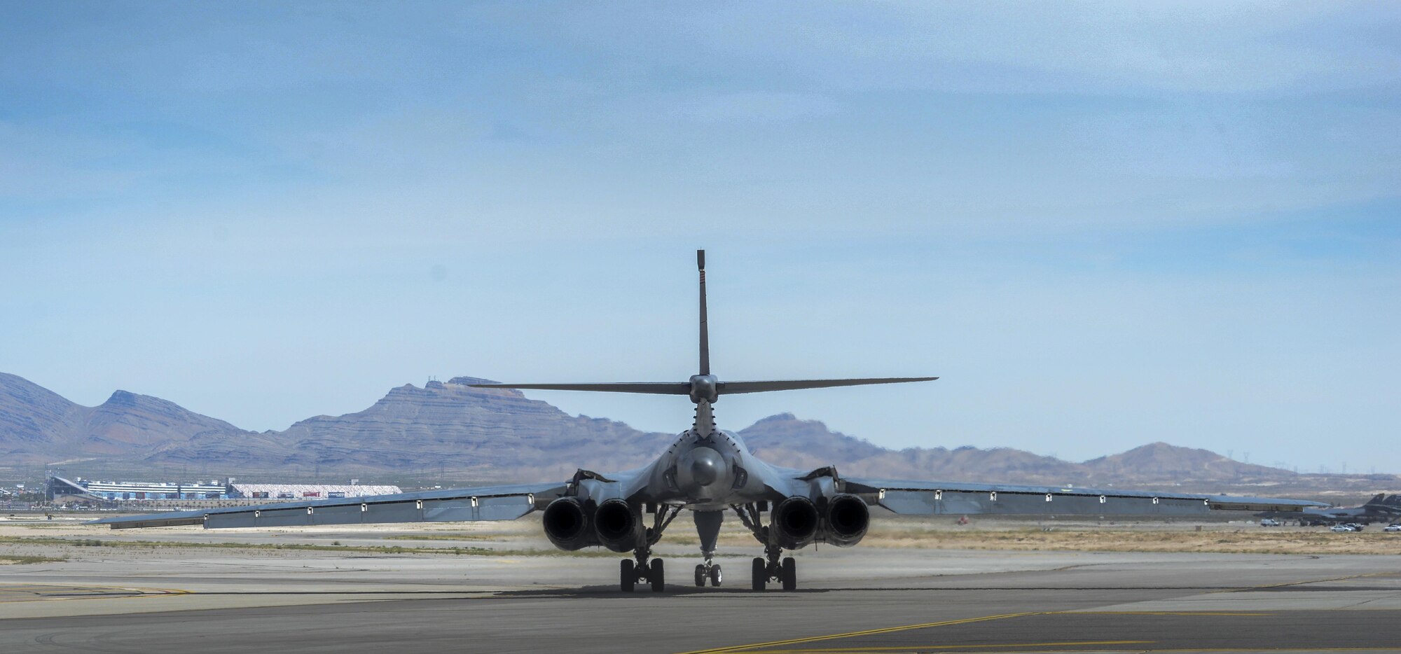 A B-1B Lancer, assigned to the 34th Bomb Squadron, Ellsworth Air Force Base, South Dakota, taxis down the runway during Green Flag 16-05 at Nellis Air Force Base, Nev., April 21, 2016. The squadrons that attend prepare to deploy in the future, the ability to throw a wrench in the day-to-day operations and force aircrews to overcome the challenges of deploying provides essential experience. (U.S. Air Force photo by Airman 1st Class Kevin Tanenbaum)