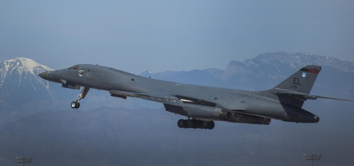 A B-1B Lancer, assigned to the 34th Bomb Squadron, Ellsworth Air Force Base, South Dakota, begins to retract landing gear while taking off during Green Flag 16-05 at Nellis Air Force Base, Nev., April 21, 2016. While the pace may be fast during Green Flag, the necessary missions that the 34th BS will eventually participate in is more than worth the price. (U.S. Air Force photo by Airman 1st Class Kevin Tanenbaum)
