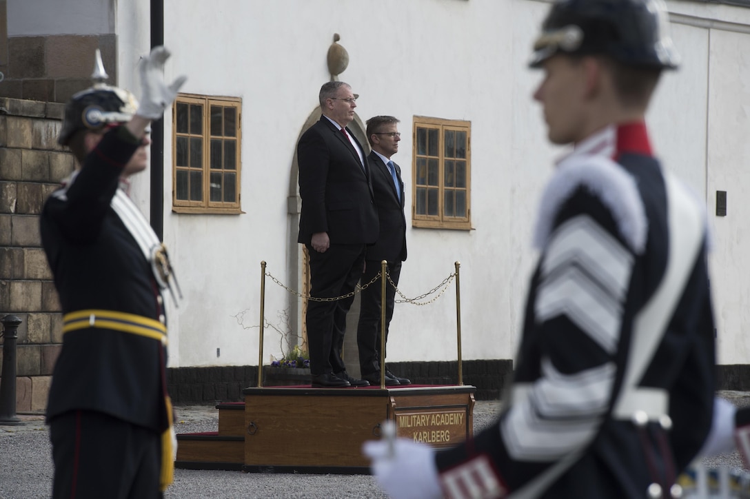 Deputy Defense Secretary Bob Work stands with Swedish State Secretary Jan Salestrand during the playing of the Swedish national anthem in Stockholm, April 26, 2016. DoD photo by Navy Petty Officer 1st Class Tim D. Godbee