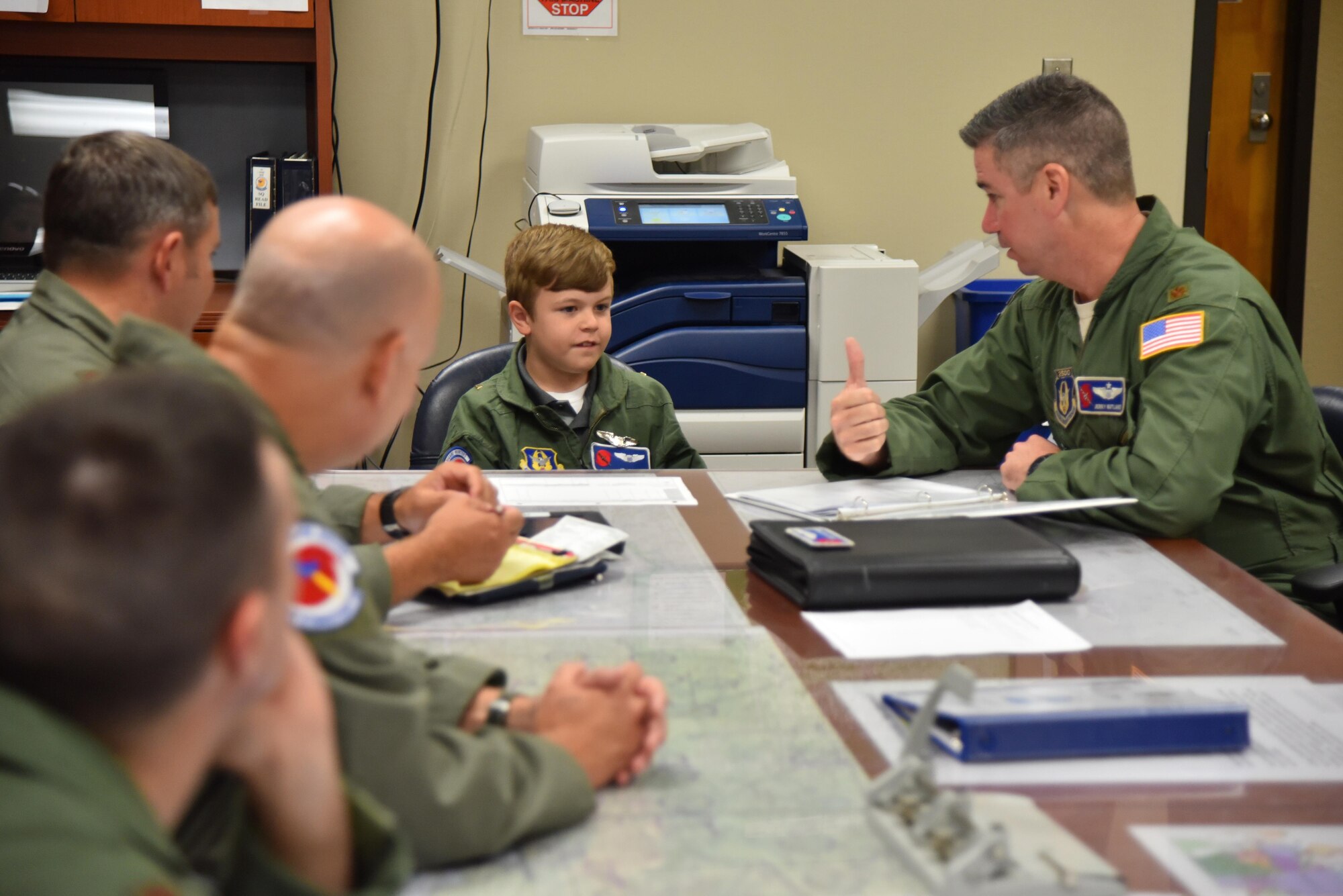 Jon Bryant “JB” Orso of the Mobile, Alabama, area became the 403rd Wing’s first Pilot for a Day at Keesler Air Force Base, Mississippi, April 26, 2016. Orso sits in on his first mission brief before his taxi ride in a WC-130J Super Hercules aircraft. The purpose of the Pilot for a Day program is to reach out to the community by providing activities to children who live with a chronic or life-threatening disease or illness. Orso is in remission after receiving treatment for Acute Lymphoblastic Leukemia. (U.S. Air Force photo/Maj. Marnee A.C. Losurdo)