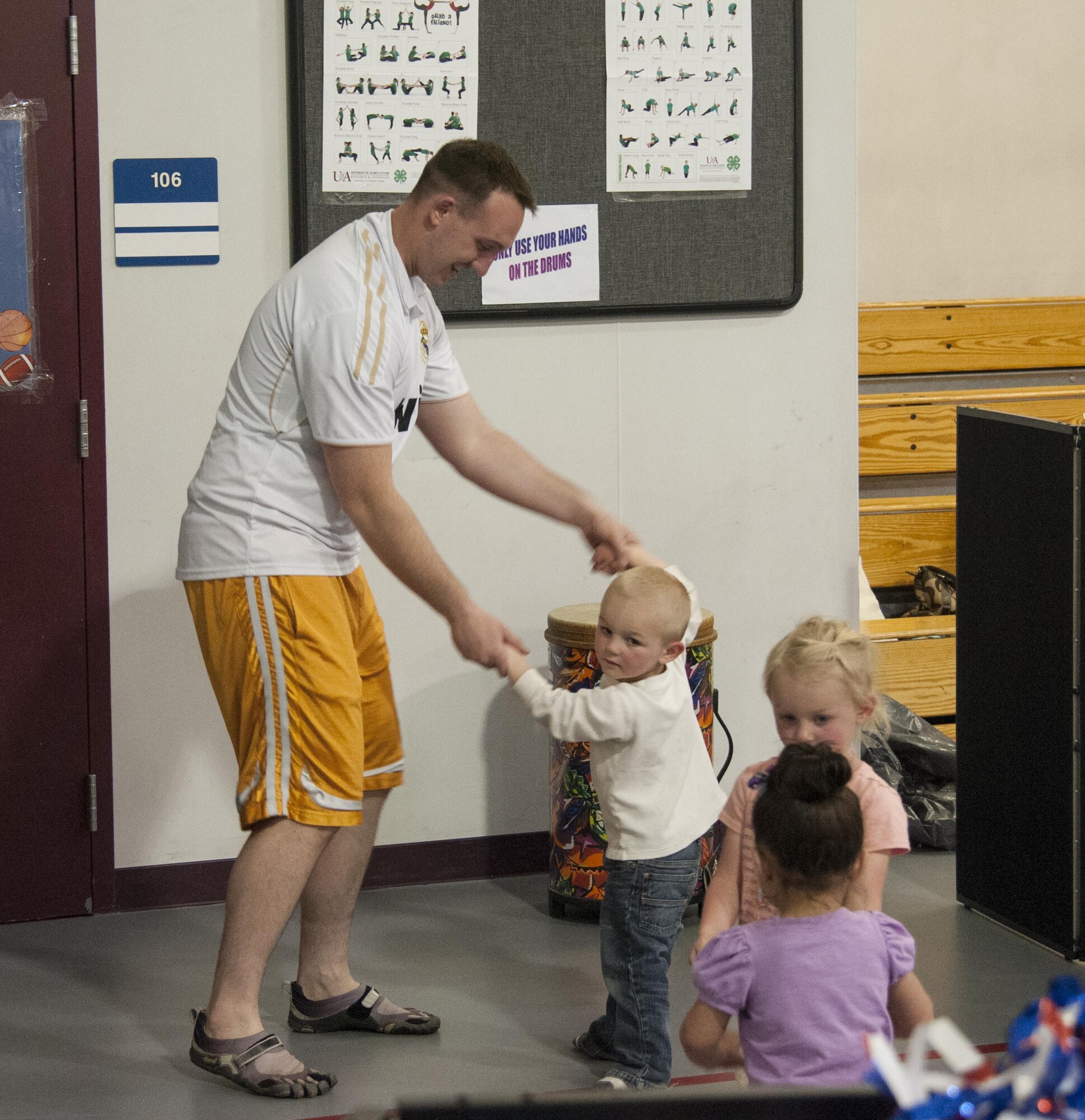 First Lt. Joseph Neary, 319th Missile Squadron missile combat crew commander, dances with his son Hyrum, 2, on the dance floor set up in the Youth Center for the Month of the Military Child Bash, on F.E. Warren Air Force Base, Wyo., April 22, 2016. The 90th Force Support Squadron Youth Center hosted the bash to give military children a place to celebrate and be with their parents. (U.S. Air Force photo by Senior Airman Jason Wiese)