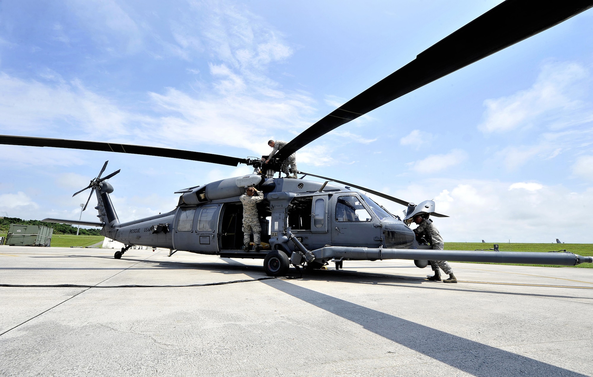 Members of the 718th Aircraft Maintenance Squadron inspect an HH-60G Pave Hawk helicopter during a pre-flight inspection, April 26, 2016, at Kadena Air Base, Japan. The 718th Aircraft Maintenance Squadron maintains military aircraft for flight to ensure safety and reliability in support of the training mission here at Kadena. These inspections are conducted 72 hours before each mission. (U.S. Air Force photo by Naoto Anazawa)
