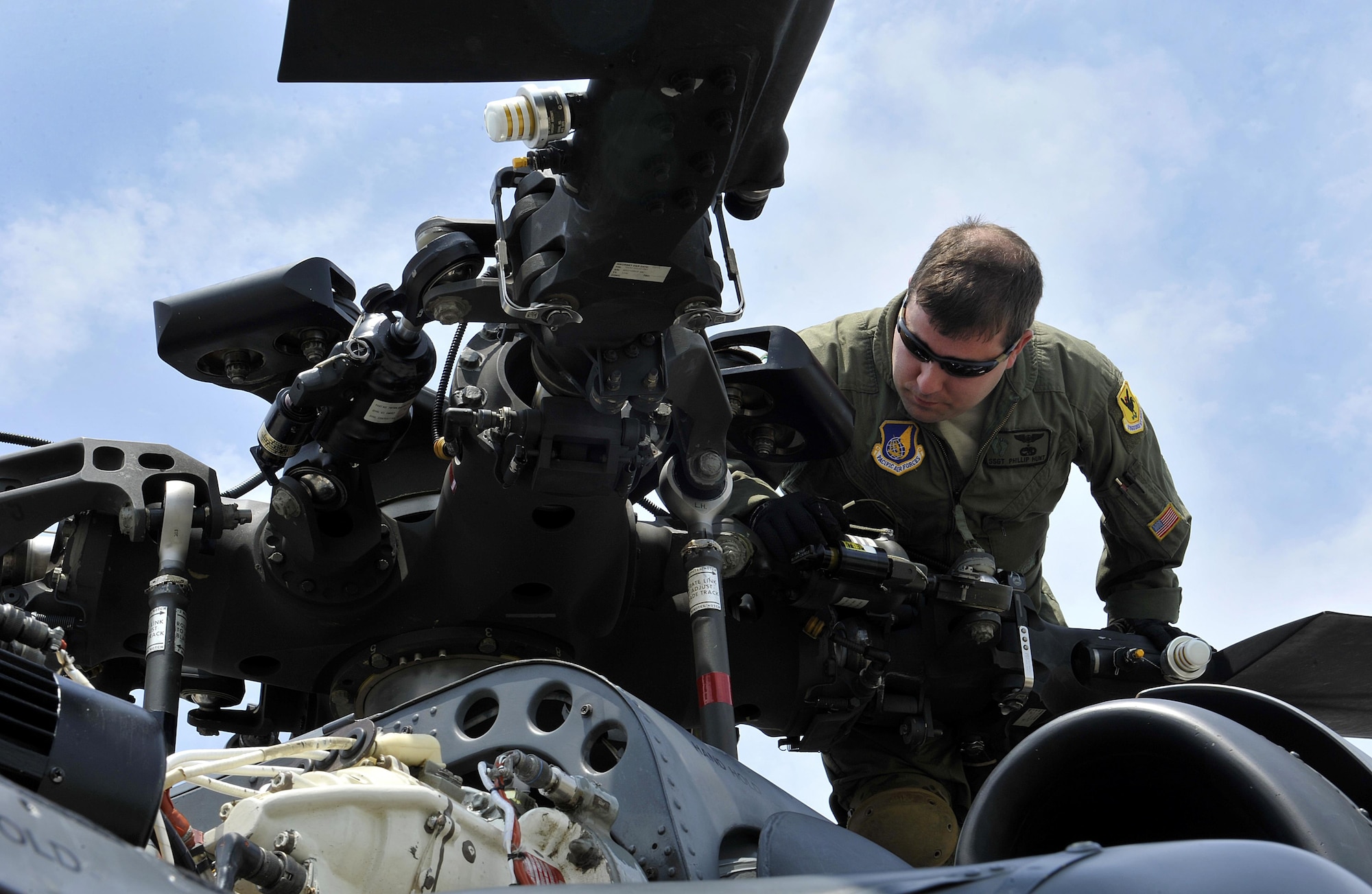 U.S. Air Force Staff Sgt. Phillip Hunt, 33rd Helicopter Maintenance Unit instructor special mission aviator, inspects the blades of an HH-60G Pave Hawk helicopter during a pre-flight inspection, April 26, 2016, at Kadena Air Base, Japan. The 33rd Rescue Squadron maintainers remain vigilant, making sure all parts and components of the helicopter are in place. (U.S. Air Force photo by Naoto Anazawa) 