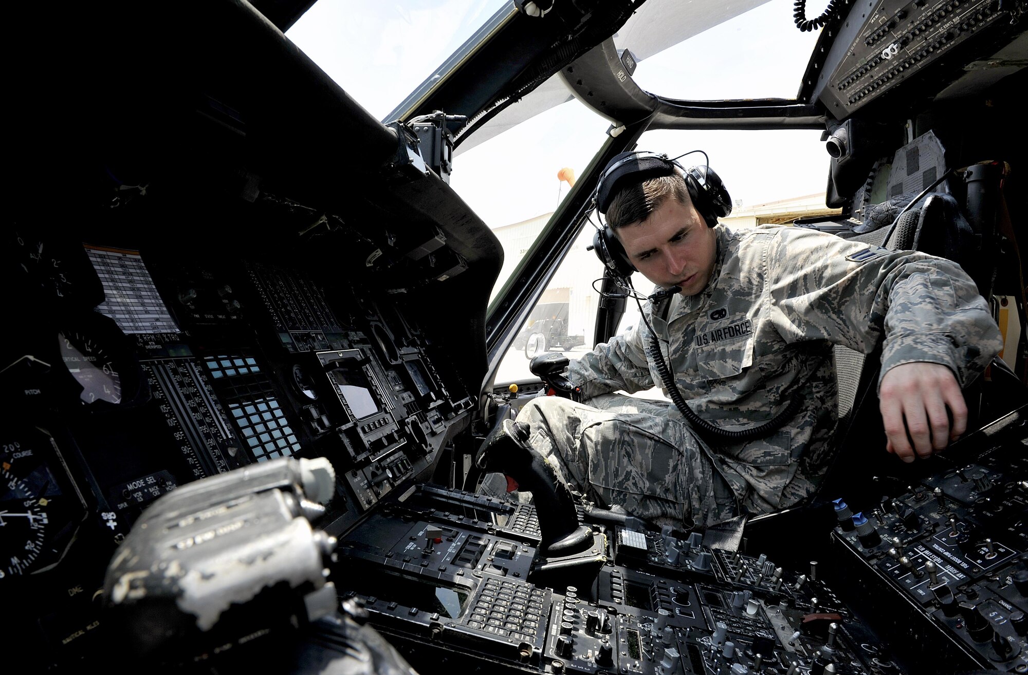 U.S. Air Force Airman 1st Class Ian Wilkerson, 718th Aircraft Maintenance Squadron communication navigation specialist, checks the radio systems of an HH-60G Pave Hawk helicopter during a pre-flight inspection, April 26, 2016, at Kadena Air Base, Japan. Maintenance and inspections are conducted before and after every mission to ensure aircraft safety and longevity. (U.S. Air Force photo by Naoto Anazawa)