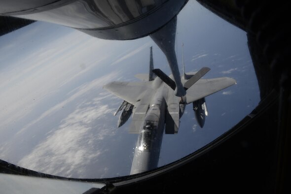 A U.S. Air Force F-15C Eagle approaches a KC-135 Stratotanker from the 909th Air Refueling Squadron during a refueling mission April 20, 2016, near Kadena Air Base, Japan. The 909th ARS is the Pacific Air Forces' "lead force" for air refueling U.S. and allied aircraft during all contingencies in the Indo-Asia-Pacific region. The squadron accomplishes vital daily aeromedical evacuations for military and civilian members, sometimes transporting patients to as far away as the United States. (U.S. Air Force photo by Senior Airman Stephen G. Eigel)