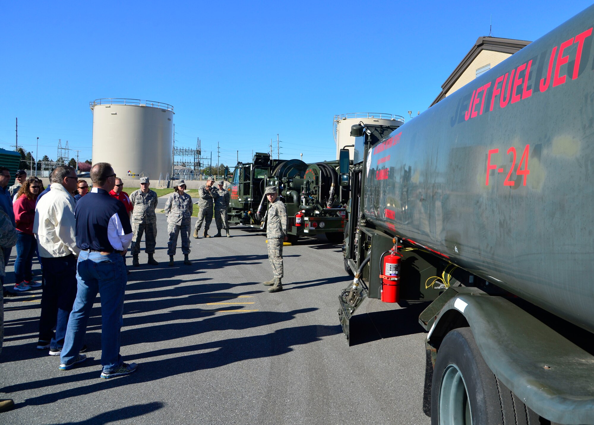 Team Dover Honorary Commanders are shown two fuel trucks from the 436th Logistics Readiness Squadron during a tour of the 436th Mission Support Group April 20, 2016, at Dover Air Force Base, Del. The honorary commanders were briefed by Airmen on how the 436th LRS Fuels Section keeps aircraft at Dover AFB fueled with clean, high quality jet fuel. (U.S. Air Force photo/Senior Airman William Johnson)