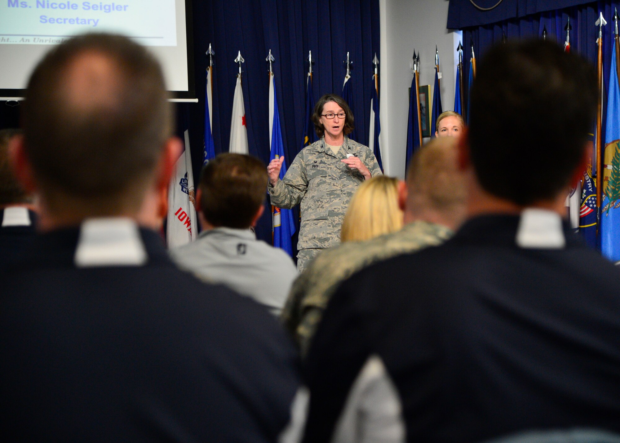 Col. Lisa Pike, 436th Mission Support Group commander, gives a mission brief to Team Dover Honorary Commanders before the start of a tour of the 436th MSG April 20, 2016, at Dover Air Force Base, Del. The honorary commanders visited the various squadrons within the 436th MSG during the tour, which included many hands-on activities. (U.S. Air Force photo/Senior Airman William Johnson)