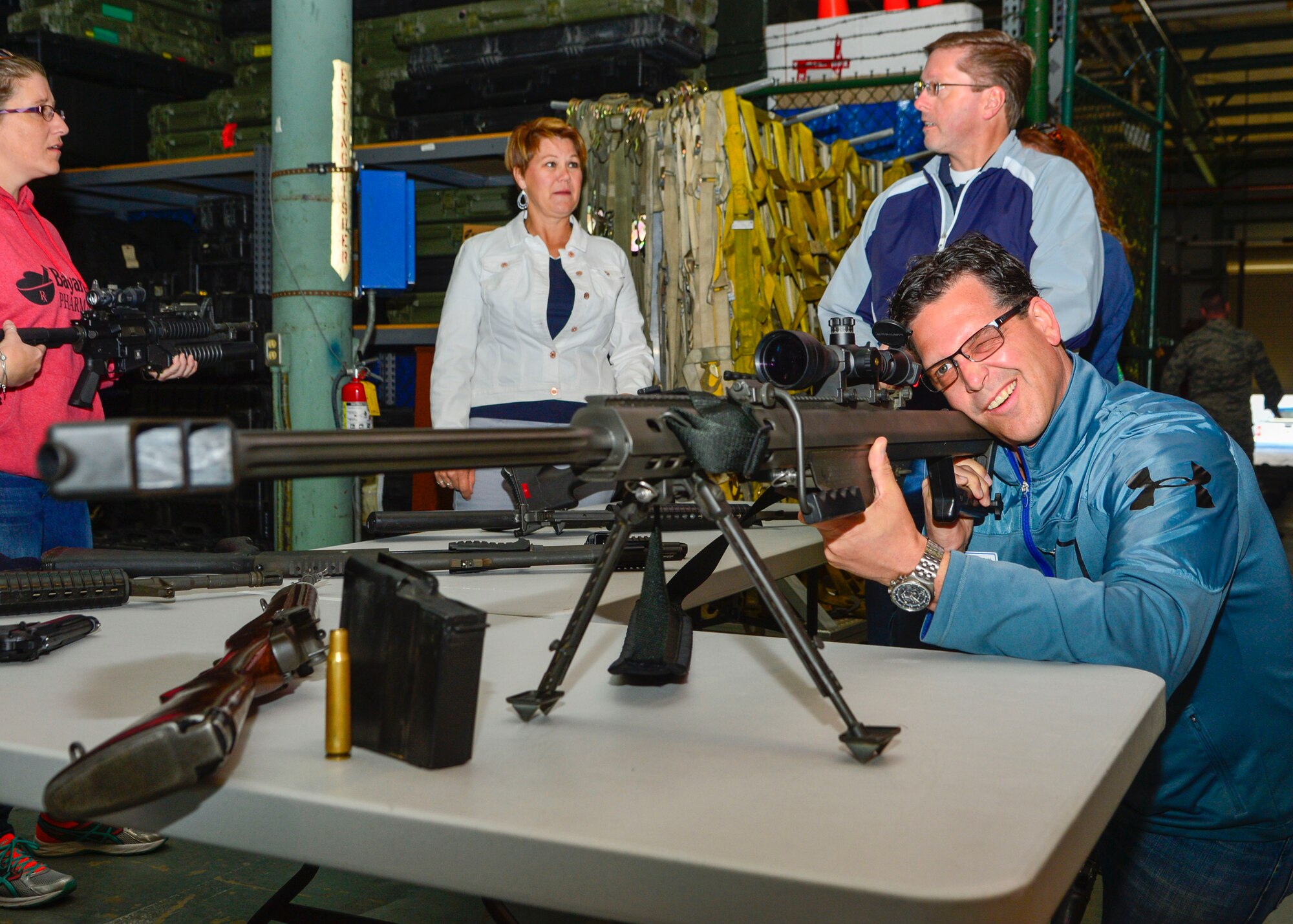 Todd Ewald, 436th Aircraft Maintenance Squadron honorary commander, looks through a scope on a display Barrett .50 Caliber sniper rifle during a tour of the 436th Mission Support Group April 20, 2016, at Dover Air Force Base, Del. The honorary commanders toured various sections of the 436th Security Forces Squadron that included demonstrations from the Ravens and military working dog handlers. (U.S. Air Force photo/Senior Airman William Johnson) 
