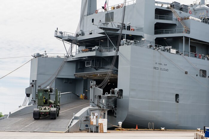 A truck is loaded aboard the U.S. Naval Ship Red Cloud, April 18, 2016, at Joint Base Charleston, S.C. – Weapons Station. Members from the Army Strategic Logistics Activity Charleston and the 841st Transportation Battalion staged, processed and configured 1,300 pieces of equipment to support  USNS Red Cloud’s prepositioned ship mission. (U.S. Air Force photo/Staff Sgt. Jared Trimarchi) 