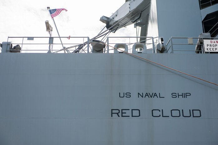 A U.S. flag waves aboard the U.S. Naval Ship Red Cloud, April 18, 2016, at Joint Base Charleston, S.C. – Weapons Station. Members from the Army Strategic Logistics Activity Charleston and the 841st Transportation Battalion staged, processed and configured 1,300 pieces of equipment to support USNS Red Cloud’s prepositioned ship mission. (U.S. Air Force photo/Staff Sgt. Jared Trimarchi) 