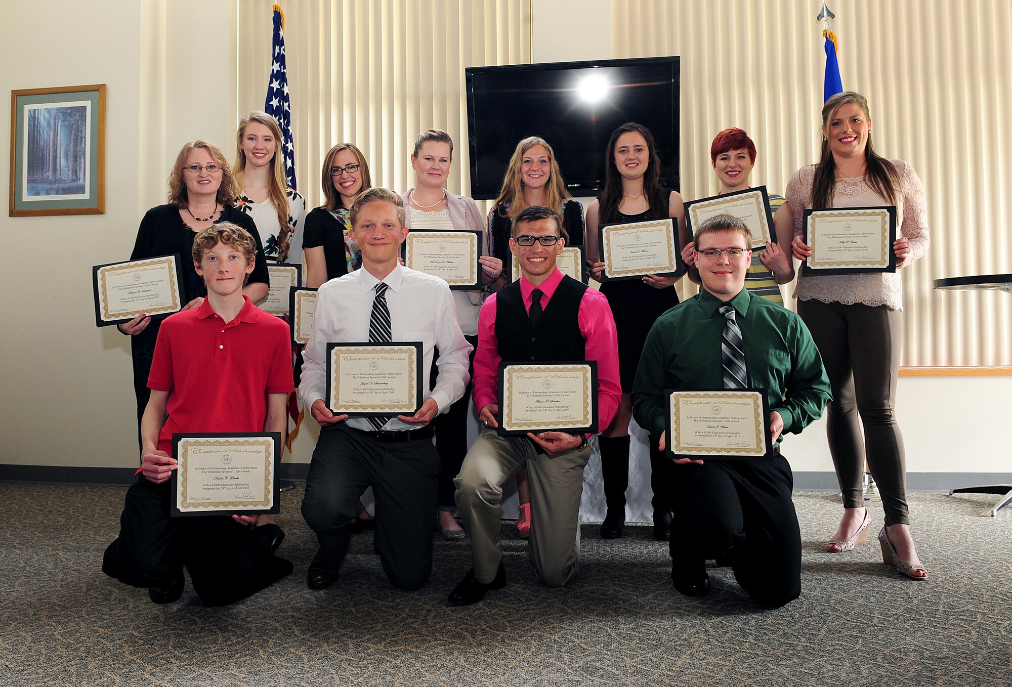 Recipients of the Whiteman Spouses’ Club education award gather for a group photo following a luncheon at Royal Oaks Golf Course in Knob Noster, Mo., April 24, 2016. Each year, profits made by the Thrift Store and other fundraising endeavors at Whiteman Air Force Base, Mo., are donated to the Scholarship Awards Program. (U.S. Air Force photo by Airman 1st Class Jazmin Smith) 
