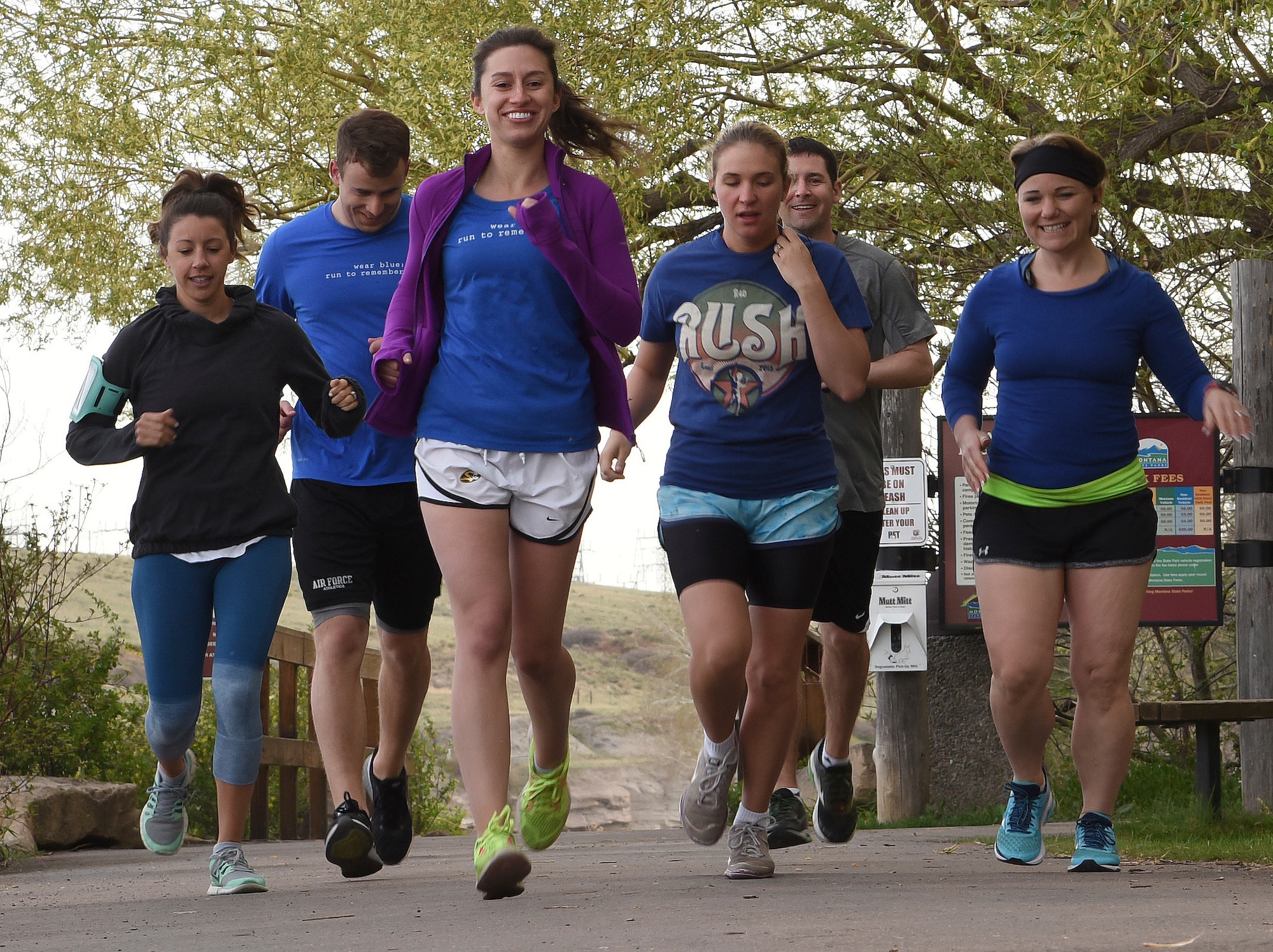 Members of the Wear Blue to Remember team take off running April 23, 2016, at Giant Springs State Park in Great Falls, Mont. The running club meets every Saturday at 8 a.m. to run in honor of those military members who have sacrificed their lives for our freedom. (U.S. Air Force photo/Senior Airman Jaeda Tookes)
