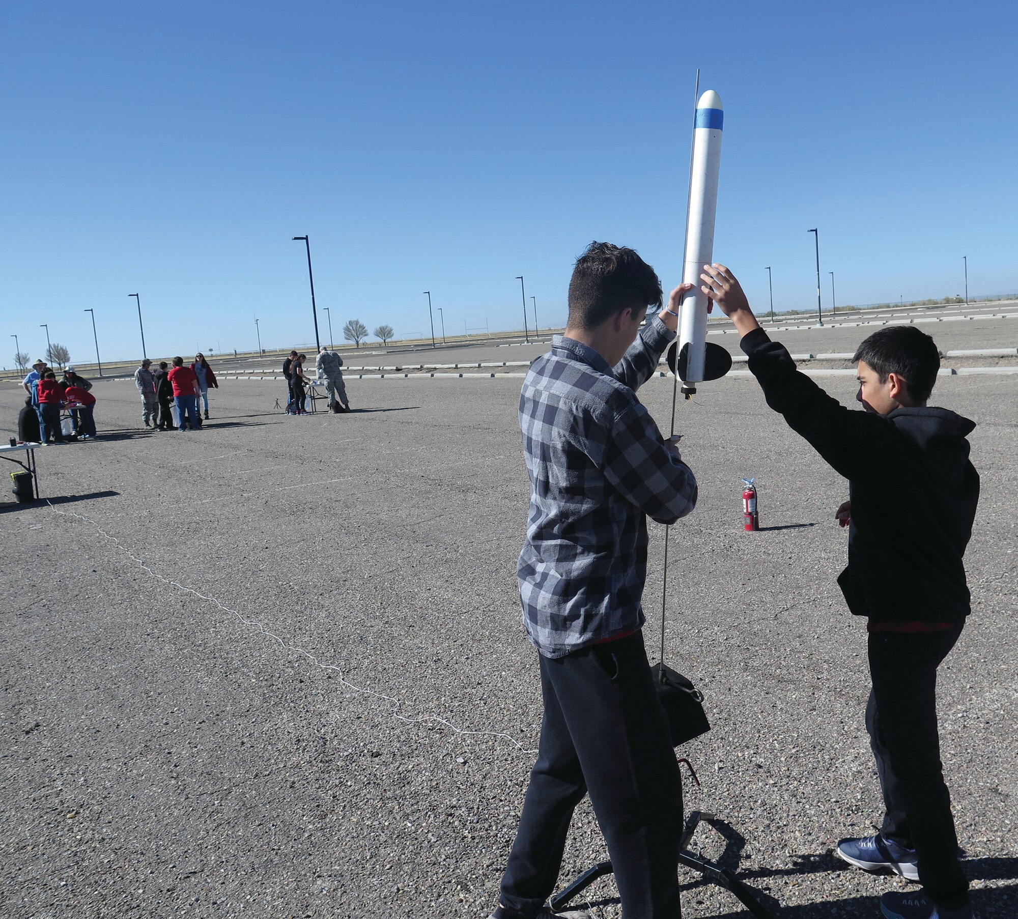 La Luz students Laken Baca, left, and Jared Trujillo prepare to launch their team's rocket. (Photo by Steve Burke)