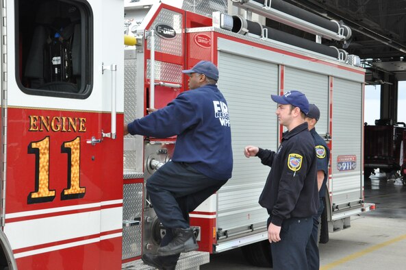 Bram Berry, Fire Captain; Jerry Hopewell, Firefighter/EMT; Kevin Kline, Firefighter/EMT, inspect Engine 11. 