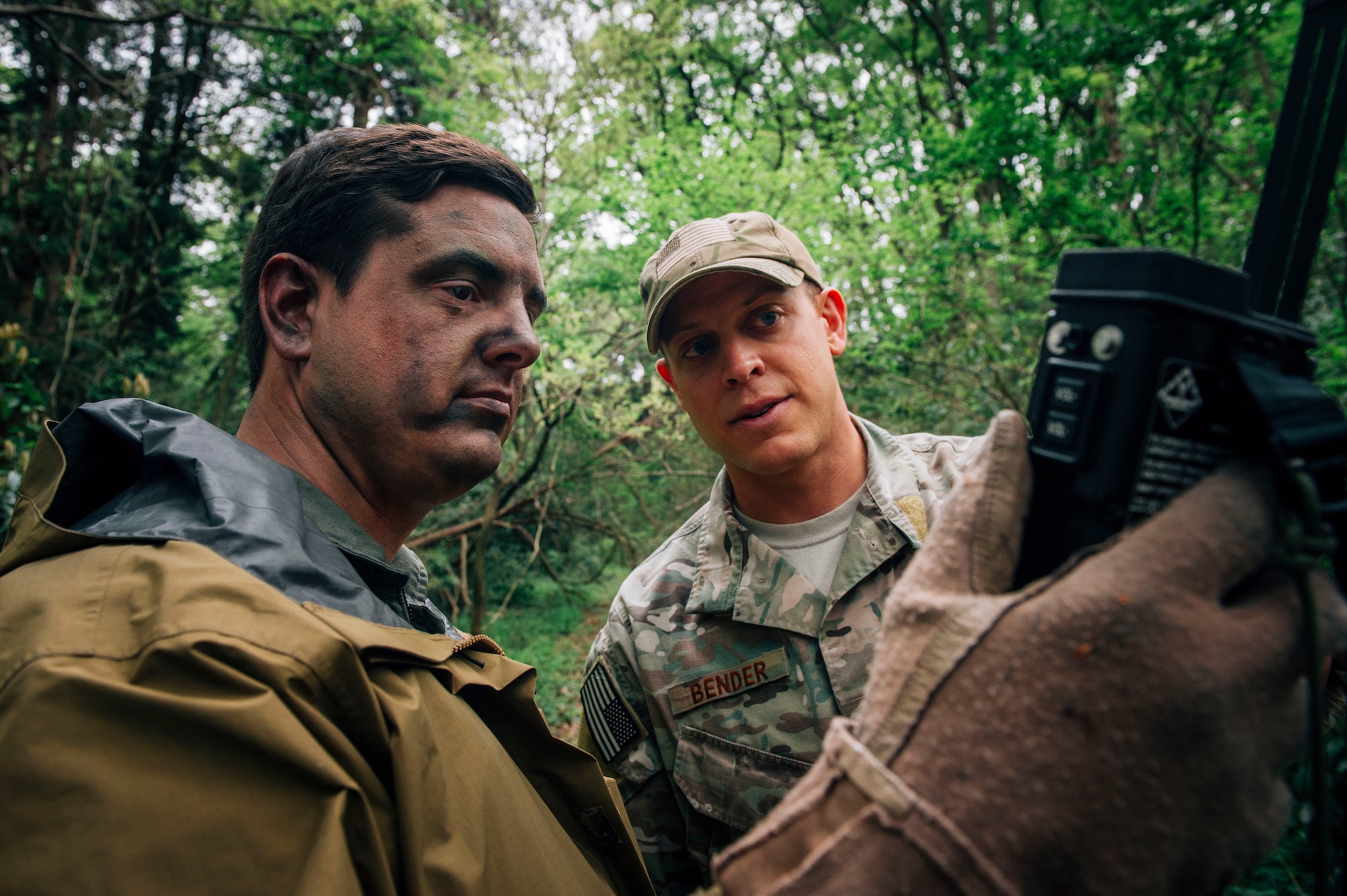 Staff Sgt. Justin Bender, 374th Operations Support Squadron Survival, Evasion, Resistance and Escape specialist, instructs a course participant on how to use GPS during combat survival training at Tama Hills Recreation Area, Japan, April 21, 2016. Being able to use various types of technology during survival courses ensures Airmen are prepared in the event of being stranded in the wilderness. (U.S. Air Force photo by Senior Airman Delano Scott/Released)