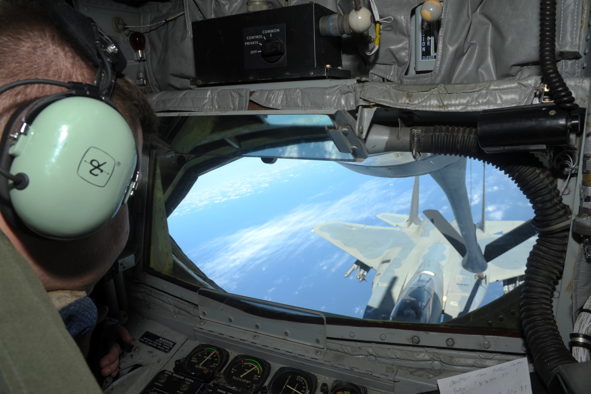 A 909th Air Refueling Squadron boom operator positions the boom of a U.S. Air Force KC-135 Stratotanker to refuel an F-15C Eagle during a refueling mission April 20, 2016, near Kadena Air Base,  Japan. The 909th ARS provides combat-ready KC-135 tanker aircrews to support peacetime operations and all levels of conflict in the Indo-Asia-Pacific theater. (U.S. Air Force photo by 1st Lt. Virginia Lang/Released)