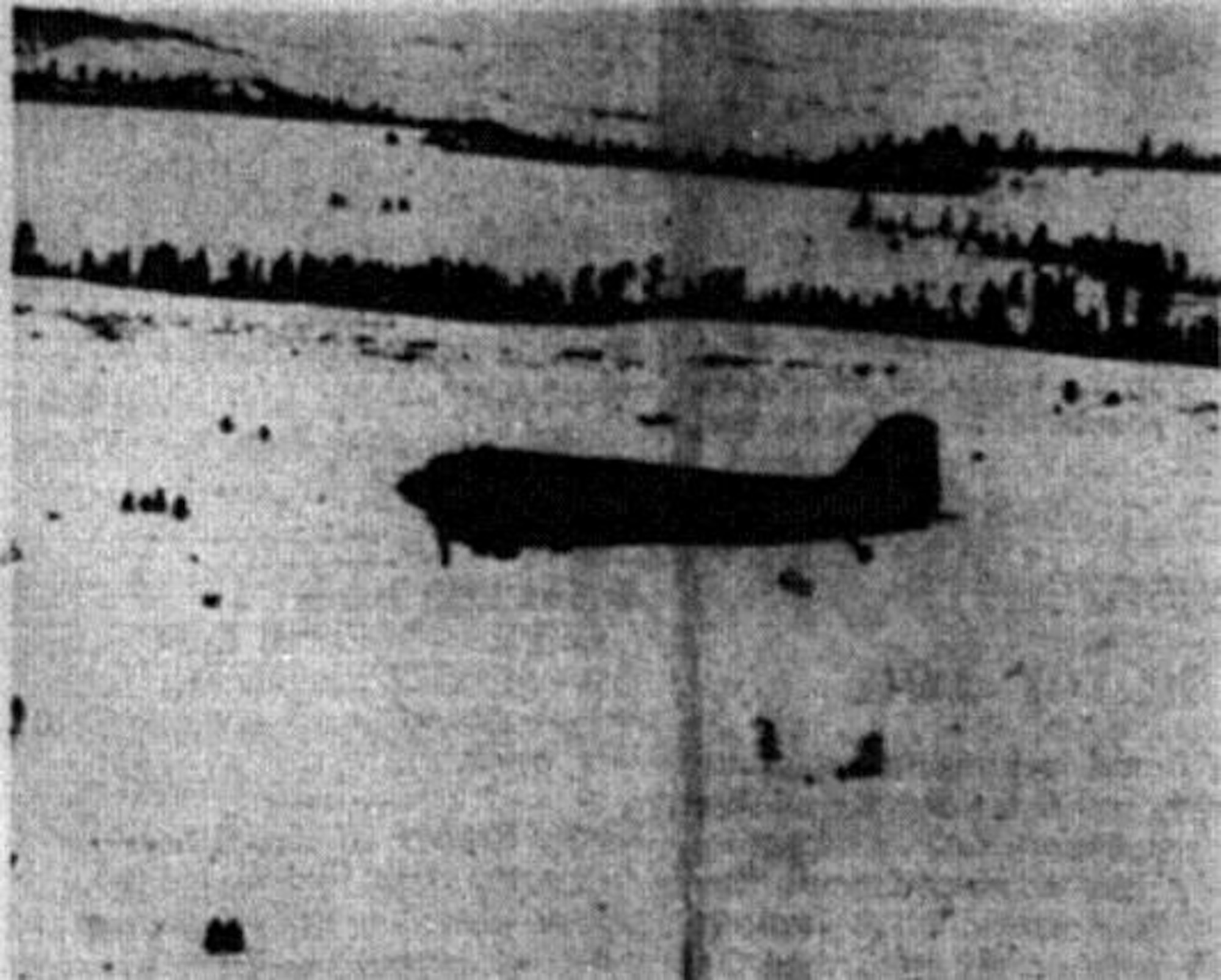 A haybale is dropped by an OreANG C-47 over the Starkey, Oregon area to elk and deer herds. (Photo by John McKean, courtesy La Grande Observer, via Eastern Oregon University Library)