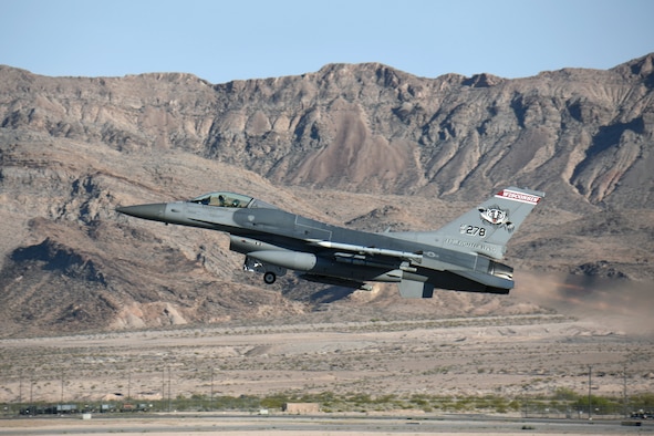 An F-16 Fighting Falcon with the 115th Fighter Wing in Madison, Wis., takes off on a training mission from Nellis Air Force Base, Nev., April 5, 2016. The Wisconsin Air National Guard unit deployed more than 100 Airmen and eight F-16 Fighting Falcons for two weeks to support advanced training in weapons and tactics employment at the United States Air Force Weapons School. (U.S. Air National Guard photo by Master Sgt. Paul Gorman/Released)