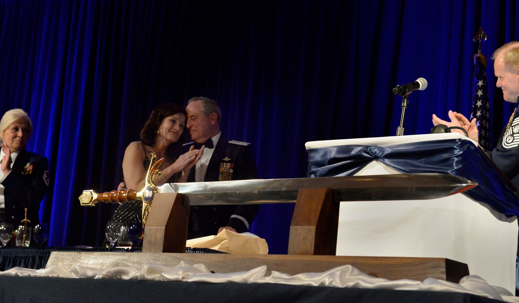 Air Force Chief of Staff Gen. Mark A. Welsh III, with his wife, Betty, is honored with the Order of the Sword, presented by Chief Master Sgt. of the Air Force James A. Cody during the Order of the Sword dining-in April 22, 2016, in Montgomery, Ala. The sword represents truth, justice and power, given to an individual who has proven to be a leader among leaders.  (U.S. Air Force photo/Scott M. Ash)