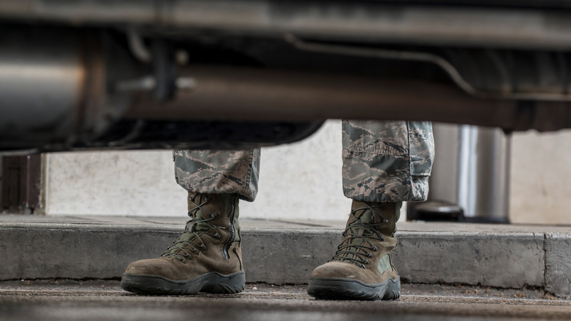 Senior Airman Matthew Yoder, 31st Security Forces Squadron monitoring facility operator, stands aside a vehicle while checking an individual’s personal identification card, April 15, 2016, at Aviano Air Base, Italy. The 31st SFS maintain installation force protection within eight separate base areas, protect resources of various sensitivities and guard two F-16 Fighting Falcon fighter squadrons. (U.S. Air Force photo by Airman 1st Class Cory W. Bush/Released)