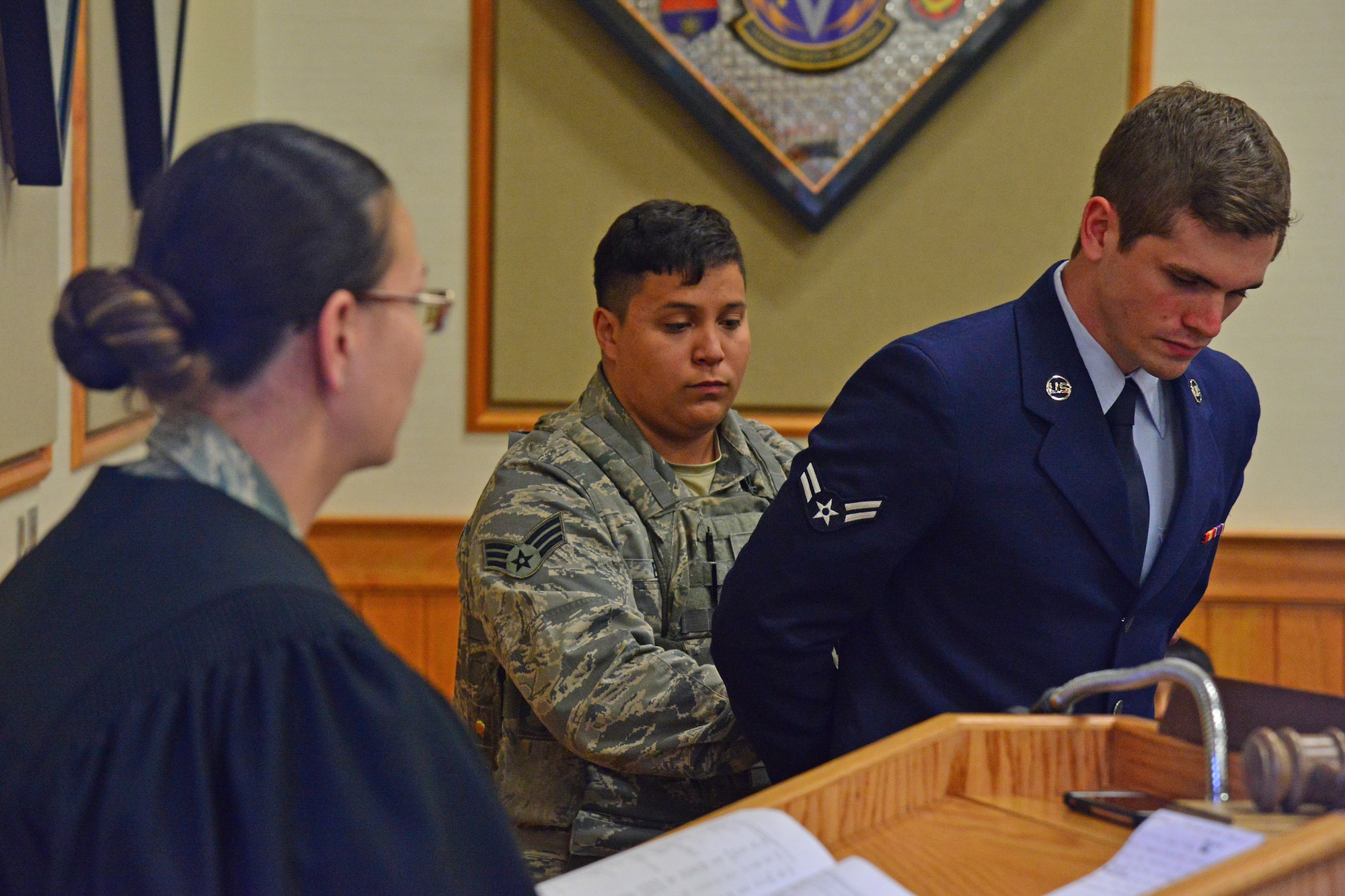 Airmen assigned to the 341st Missile Wing simulate a conviction from the staff judge advocate office in a Live or Die demonstration April 25, 2016, at Malmstrom Air Force Base, Mont. The base hosted the event as part of the Drink Smart campaign which focused on subject education about the possible consequences of a drunk driving situation. (U.S. Air Force photo/Airman Daniel Brosam)