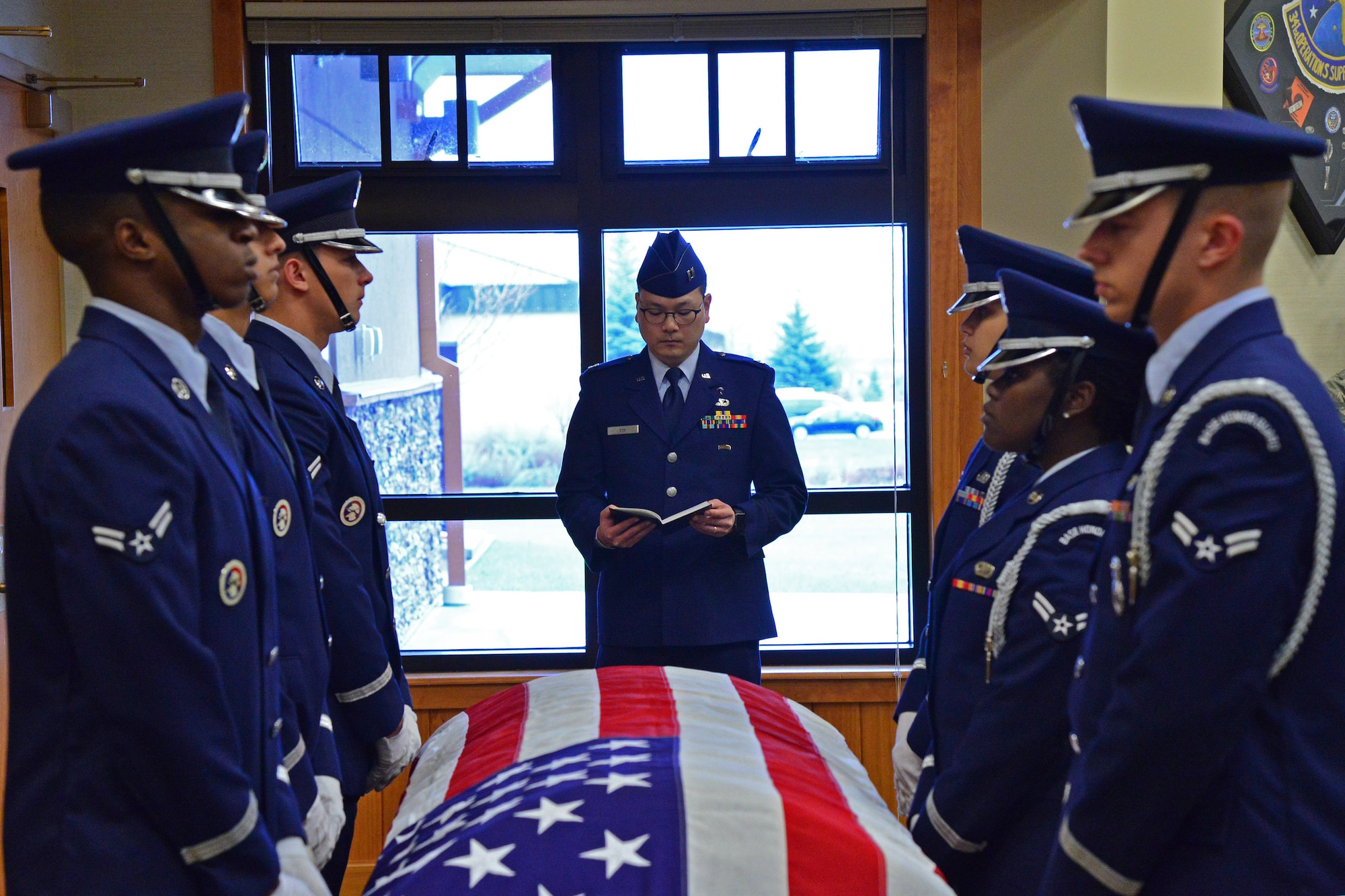 Airmen assigned to the Malmstrom Air Force Base Honor Guard participate in a Live or Die demonstration, simulating possible consequences of a drunk driving situation April 25, 2016, at Malmstrom Air Force Base, Mont. The honor guard performed a funeral for the simulated deceased Airmen complete with a six-man flag fold as well as a three-volley salute. (U.S. Air Force photo/Airman Daniel Brosam)