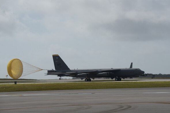 Brig. Gen. Andrew Toth, 36th Wing commander, is sprayed with water by friends and family after landing a B-52 Stratofortress during a fini-flight April 26, 2016, at Andersen Air Force Base, Guam. The fini-flight, which is a tradition carried throughout the Air Force, marks Toth’s final flight on Guam. (U.S. Air Force photo by Senior Airman Cierra Presentado)