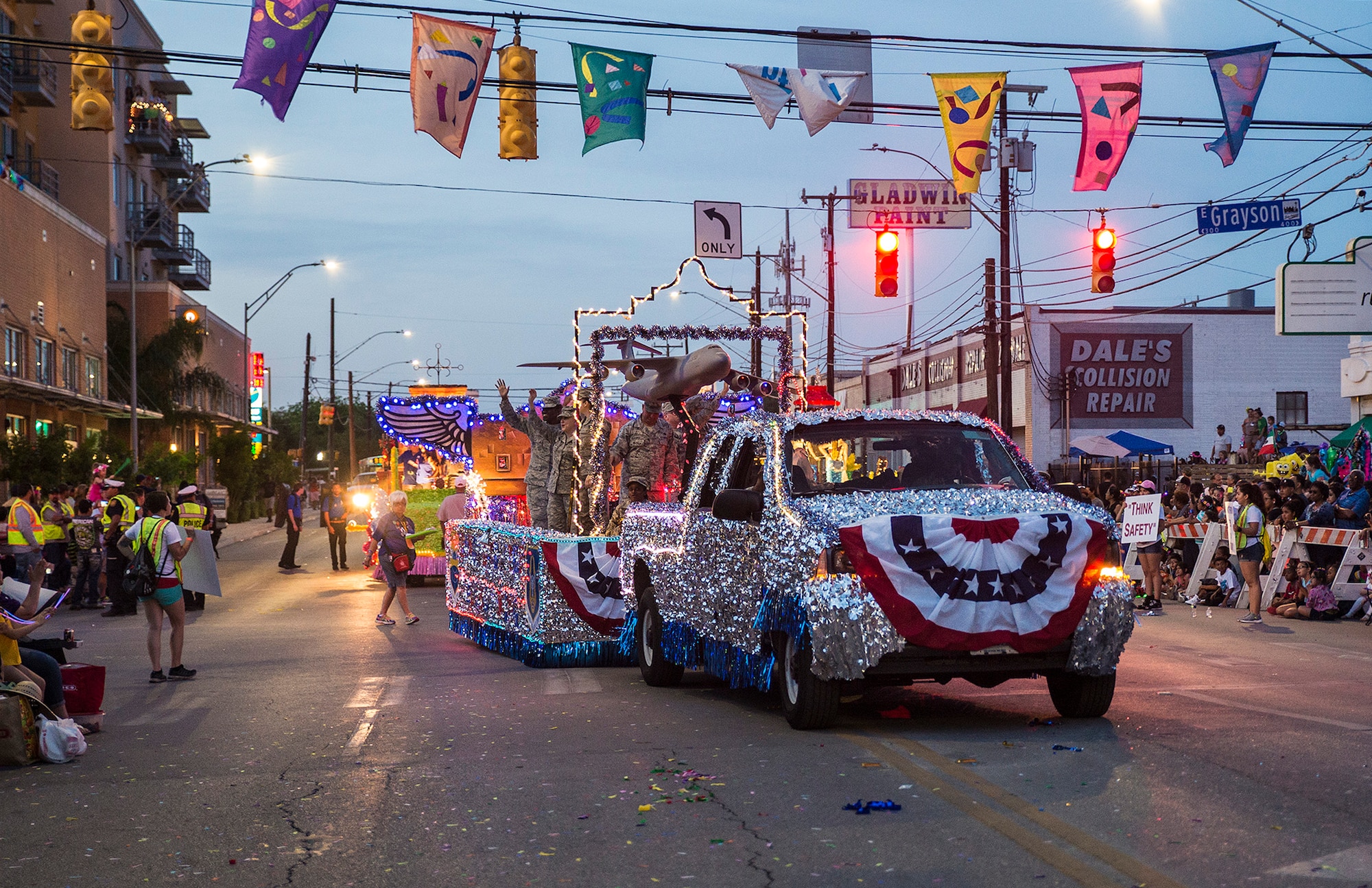 The 433rd Airlift Wing float travels down the Fiesta Flambeau parade route in San Antonio Texas April 23, 2016. The Fiesta Flambeau parade is one of the largest illuminated parades in the world, with over 750,000 spectators and 1.5 million television viewers. (U.S. Air Force photo by Benjamin Faske) (released)