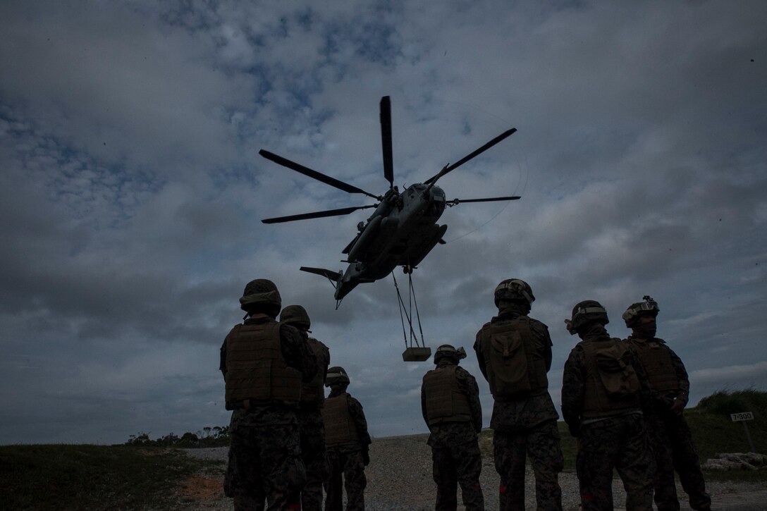 Marines conduct a helicopter support team exercise at Marine Corps Air Station Futenma, Okinawa, Japan, April 22, 2016. The Marines are landing support specialists, commonly referred to as red patchers, with Landing Support Detachment, 3rd Transportation Support Battalion, Combat Logistics Regiment 3, 3rd Marine Logistics Group, III Marine Expeditionary Force. 
