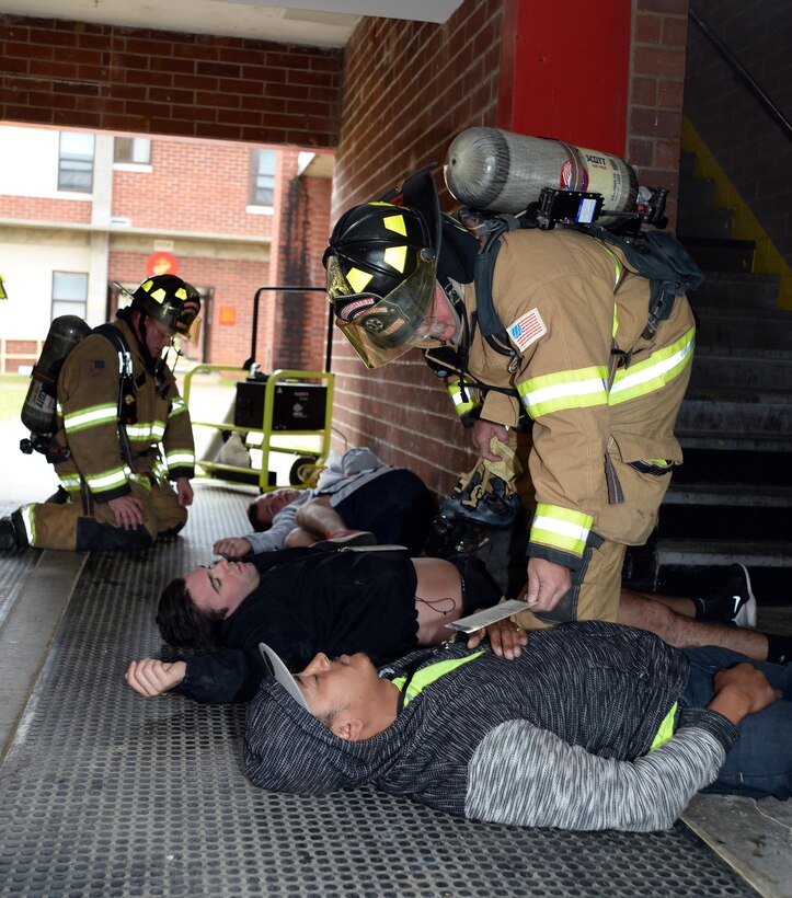 Marine Corps Logistics Base Albany firefighters evaluate role players portraying as injured victims during Exercise Black Swan 2016, here, April 12.