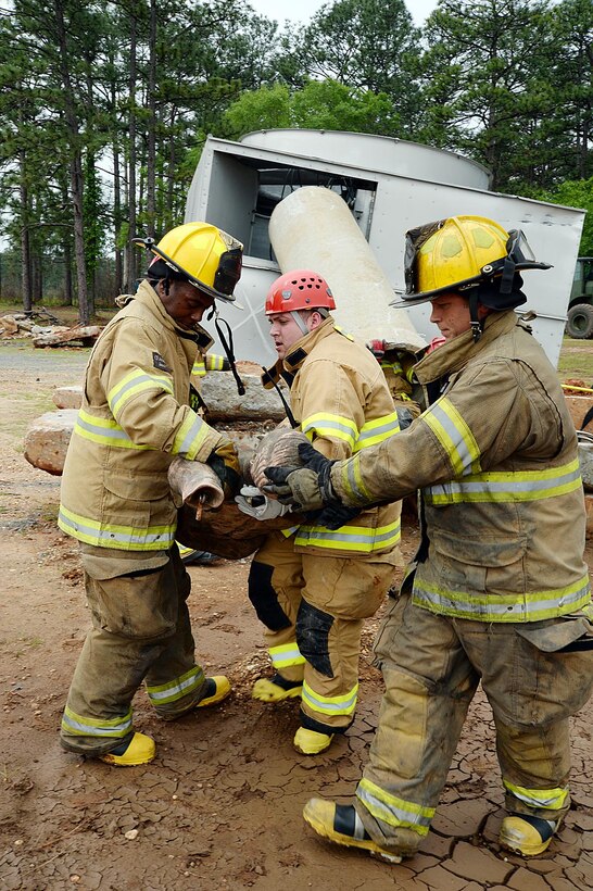 Firefighters from various fire departments throughout the area rescue a simulated injured victim during Exercise Black Swan 2016 aboard Marine Corps Logistics Base Albany, April 12.