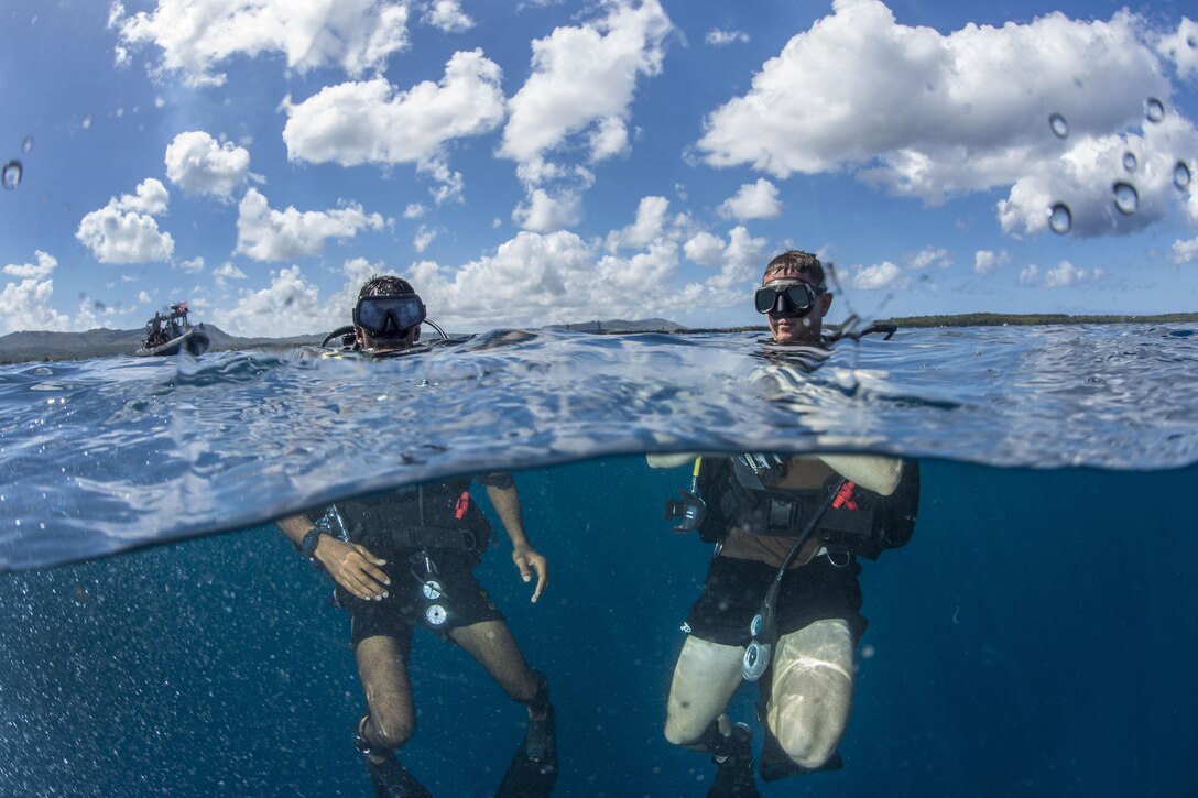 Navy Lt. Ryan Snow, right, treads water with a Sri Lankan navy sailor during a joint diving exercise in the Apra Harbor off the coast of Guam, April 13, 2016. Navy photo by Petty Officer 3rd Class Alfred A. Coffield
