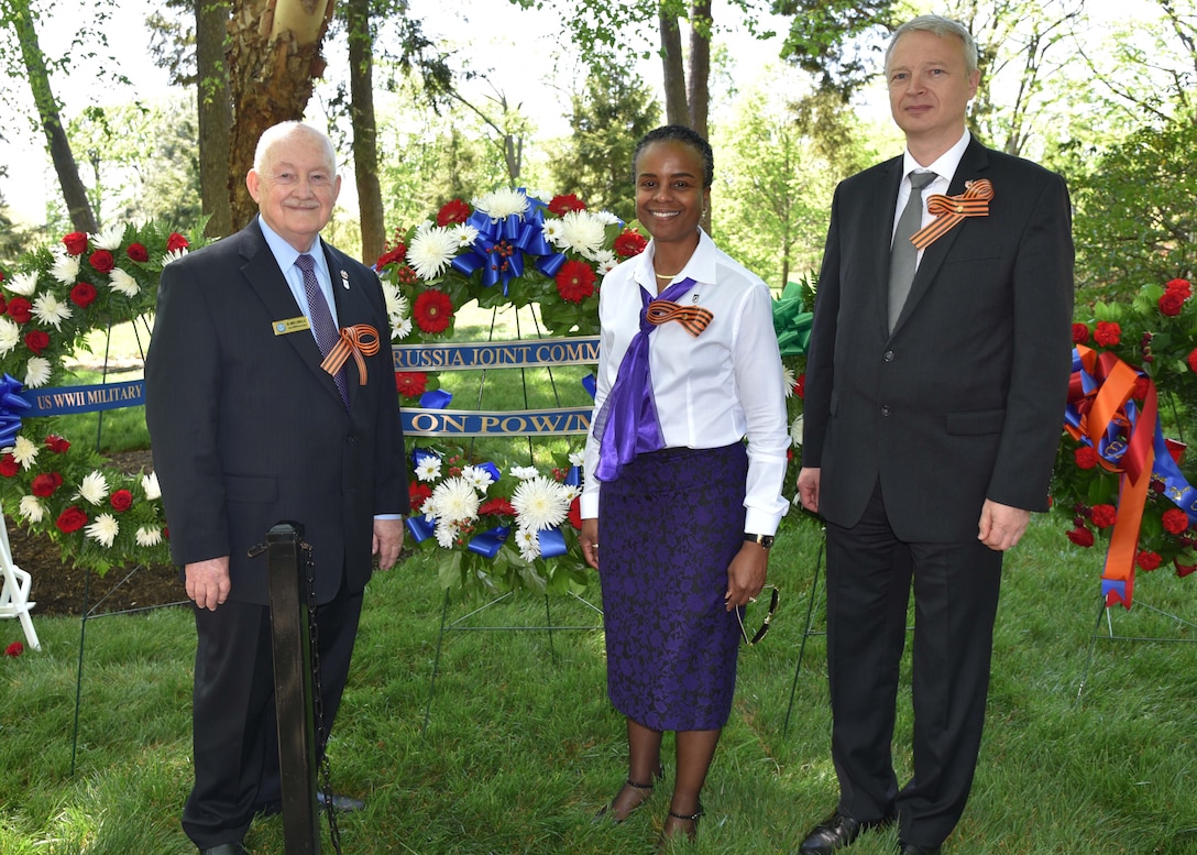 Mrs. Fern Sumpter Winbush, principal director for the Defense POW/MIA Accounting Agency, lays a wreath at the Spirit of the Elbe plaque at Arlington National Cemetery, April 25, to commemorate the 71st Anniversary of the Meeting on the Elbe of Soviet and American troops in 1945.  This was the 22nd annual ceremony sponsored by the Russian Embassy and the U.S. and Russian veterans group.  Sumpter Winbush was accompanied by Dr. James Connell, Jr., acting executive secretary of the U.S. side of U.S.-Russia Joint Commission on POW/MIAs and Mr. Maxim Nikolayevich Alexeyev, chief of the Washington office of the Russian side of USRJC.  (Photos by Staff Sgt. Kristen Duus, DPAA PAO.)
