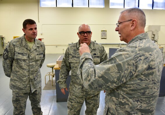 Commander of the 932nd Airlift Wing, Col. Jonathan Philebaum, discusses maintenance issues with Command Chief Master Sgt. Chad Welch (left) and the supervisor of the 932nd Metal Technology Shop, Master Sgt. Glenn Greene (center).  Colonel Philebaum took several days recently to make the rounds and meet people throughout the Illinois unit at Scott Air Force Base, which is part of 22nd Air Force, Air Force Reserve Command.  (U.S. Air Force photo by Tech. Sgt. Christopher Parr)