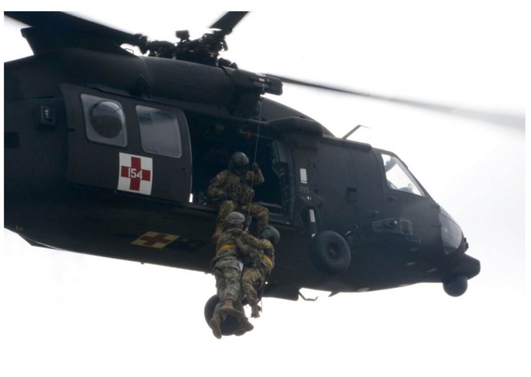 First Army commanding general, LTG Michael S. Tucker, learned hoist operations up close and personal on 20 April 2016.  LTG Tucker, bottom right, dangling from the line, took part in hoist training conducted by Army Reserve Soldiers from the 7th Battalion, 158th Aviation Regiment while training for an upcoming deployment in support of contingency operations.