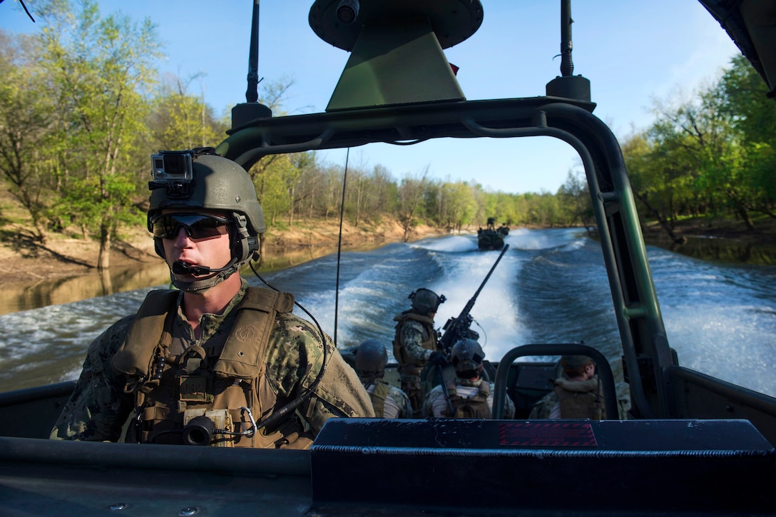Navy Petty Officer 3rd Class Joseph Camp navigates a waterway during an annual training exercise near Fort Knox, Ky., April 17, 2016. Camp is a coxswain assigned to Coastal Riverine Squadron 4. Navy photo by Petty Officer 2nd Class Gabriel Bevan