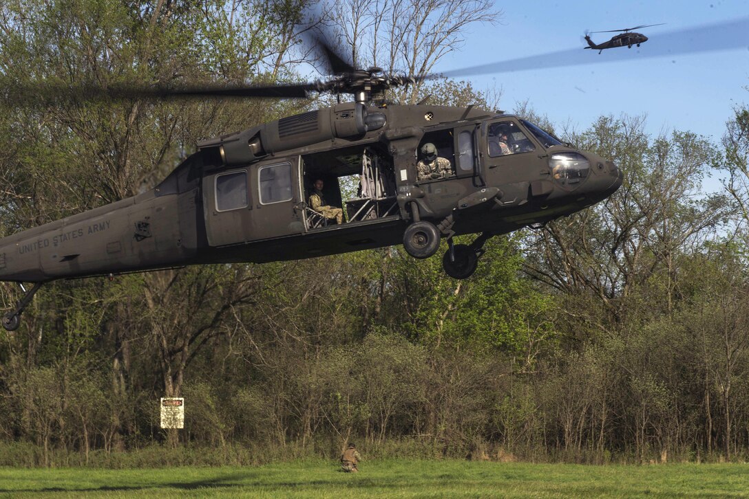 Army HH-60 Black Hawk helicopters participate in a simulated medical evacuation drill with sailors during an annual training exercise near Fort Knox, Ky., April 17, 2016. Navy photo by Petty Officer 2nd Class Gabriel Bevan