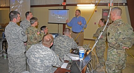 Instructor Tim Medin of the Sans Institute holds an after action review for Soldiers and Airmen participating in the Cyber City portion of the Cyber Shield 2016 exercise going on at Camp Atterbury, Ind., on Wednesday, April 20. (Indiana National Guard photo by Master Sgt. Brad Staggs, Atterbury-Muscatatuck Public Affairs)