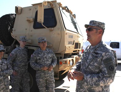 U.S. Army Reserve Chief Warrant Officer Eugene C. Peters, a mobility warrant officer from Sacramento, Calif., with the 397th Direct Distribution Support Battalion, speaks to Army Reserve Soldiers at Joint Forces Training Base Los Alamitos, Calif., before they board a training flight on a C-17 Globemaster III April 23, 2016. The training flight, which transported an Army Light Medium Tactical Vehicle and troops from JFTB Los Alamitos to Naval Air Station North Island, Calif., was part of Operation Patriot Hook. Operation Patriot Hook is a joint service and inter-agency exercise which partners local military branches with members of local, federal, and state agencies to practice their combined response procedures in case of major regional disasters such as earth quakes, riots, or fires. In its 29th year as an exercise, agencies involved in this year's Operation Patriot Hook included the U.S. Army Reserve, the U.S. Air Force Reserve, the Department of Homeland Security, and the FBI. (U.S. Army Photo by Pfc. Nicholle D. Salvatierra, 222nd Broadcast Operations Detachment).