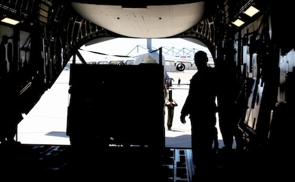 U.S. Army Reserve Chief Warrant Officer Eugene C. Peters, a mobility warrant officer from Sacramento, Calif., with the 397th Direct Distribution Support Battalion, offloads an Army Light Medium Tactical Vehicle from a C-17 Globemaster III aircraft at Naval Air Station North Island, Calif., during Operation Patriot Hook April 23, 2016. Operation Patriot Hook is a joint service and inter-agency exercise which partners local military branches with members of local, federal, and state agencies to practice their combined response procedures in case of major regional disasters such as earth quakes, riots, or fires. In its 29th year as an exercise, agencies involved in this year's Operation Patriot Hook included the U.S. Army Reserve, the U.S. Air Force Reserve, the Department of Homeland Security, and the FBI. (U.S. Army Photo by Pfc. Nicholle D. Salvatierra, 222nd Broadcast Operations Detachment).