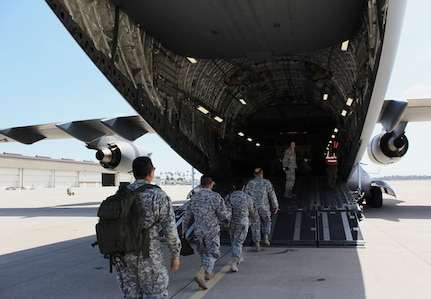 Army Reserve Soldiers board a C-17 Globemaster III at Joint Forces Training Base Los Alamitos, Calif., on April 23, 2016, at Joint Forces Training Base Los Alamitos during Operation Patriot Hook. Operation Patriot Hook is a joint service and inter-agency exercise which partners local military branches with members of local, federal, and state agencies to practice their combined response procedures in case of major regional disasters such as earth quakes, riots, or fires. In its 29th year as an exercise, agencies involved in this year's Operation Patriot Hook included the U.S. Army Reserve, the U.S. Air Force Reserve, the Department of Homeland Security, and the FBI. (U.S. Army Photo by Pfc. Nicholle D. Salvatierra, 222nd Broadcast Operations Detachment).