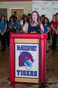 Staff Sgt. Michelle Satterfield, with the 14th Quartermaster Detachment, gives her thanks and gratitude to the students of the McKeesport Area High School during a ceremony for her in McKeesport, Pa., April 25, 2016. Satterfield is receiving a house built by the students and the Stephen Siller Tunnel to Towers Foundation for all of the volunteer work she has done in the past years. (U.S. Army photo by Staff Sgt. Dalton Smith / Released)