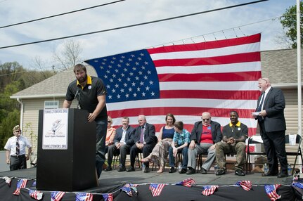 Alejandro Villanueva, Pittsburgh Steelers offensive tackle and former U.S. Army Ranger, talks about how the Steelers have supported the building of the house for Staff Sgt. Michelle Satterfield, with the 14th Quartermaster Detachment, during her ceremony in McKeesport, Pa., April 25, 2016. Satterfield is receiving a house built by the students of the McKeesport Area High School and Stephen Siller Tunnel to Towers Foundation for all of the volunteer work she has done in the past years. (U.S. Army photo by Staff Sgt. Dalton Smith / Released)